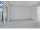 Bright bedroom with sliding glass doors and light gray floors at 3024 Kensington Ave, Davenport, FL 33837