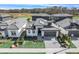 Stylish home boasts a two-car garage, stone accents, a well-kept lawn, and modern architectural details at 3024 Kensington Ave, Davenport, FL 33837