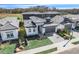 Contemporary two-story home featuring well-manicured lawn, stone accents, and a two-car garage in a desirable community at 3024 Kensington Ave, Davenport, FL 33837