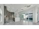 Modern kitchen features gray cabinetry, a center island, and seamless access to the outdoor pool area at 3024 Kensington Ave, Davenport, FL 33837