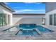 Inviting backyard pool and spa features a waterfall, patio, and seamless indoor/outdoor living at 3024 Kensington Ave, Davenport, FL 33837