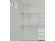Spacious walk-in closet with custom shelving, drawer storage, and bright white interior at 3024 Kensington Ave, Davenport, FL 33837
