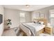 Cozy bedroom with neutral tones and a large window for natural light at 3028 Water Clover Ct, Apopka, FL 32712