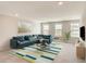 Large living room with comfortable seating and lots of windows at 3028 Water Clover Ct, Apopka, FL 32712