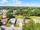 Aerial shot of home, showcasing landscaping and surrounding neighborhood, nearby golf course at 32537 Oak Park Dr, Leesburg, FL 34748