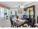 Elegant dining room featuring a large dining table, hutch, and decorative lighting at 32537 Oak Park Dr, Leesburg, FL 34748