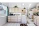 Bright kitchen with ample cabinet space, neutral countertops, and tiled flooring at 32537 Oak Park Dr, Leesburg, FL 34748