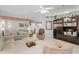 Comfortable living area with high ceilings, large windows, and classic furnishings at 32537 Oak Park Dr, Leesburg, FL 34748