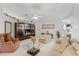 Inviting living room with elegant decor, a glass coffee table and an entertainment center at 32537 Oak Park Dr, Leesburg, FL 34748