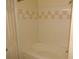 Bathroom featuring a soaking tub with tiled walls and a shower head at 3364 Westchester Square Blvd # 204, Orlando, FL 32835