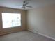 Bedroom featuring natural light from a window and neutral colored walls and carpeting at 3364 Westchester Square Blvd # 204, Orlando, FL 32835