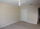 Bedroom featuring a ceiling fan, and doorways and closets on either side of the room at 3364 Westchester Square Blvd # 204, Orlando, FL 32835