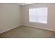 Calm bedroom with neutral carpet, a ceiling fan, and large windows providing plenty of natural light at 3364 Westchester Square Blvd # 204, Orlando, FL 32835