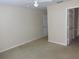 View of the bedroom featuring neutral carpeting, a ceiling fan, and an open doorway at 3364 Westchester Square Blvd # 204, Orlando, FL 32835
