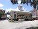 Community entrance gate with clock tower and lush landscaping in a desirable location at 3364 Westchester Square Blvd # 204, Orlando, FL 32835