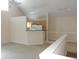 Bright living room features vaulted ceilings, a ceiling fan, and a breakfast bar leading into the kitchen at 3364 Westchester Square Blvd # 204, Orlando, FL 32835