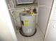 Utility closet with a standard hot water heater installed on tile flooring at 3364 Westchester Square Blvd # 204, Orlando, FL 32835