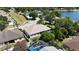 Aerial view of the property featuring a backyard pool and a view of the surrounding neighborhood at 3436 Herringridge Dr, Orlando, FL 32812