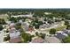 Aerial view of a residential area with a home marked by a red location pin and city skyline at 3436 Herringridge Dr, Orlando, FL 32812