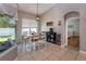 Bright dining room featuring a modern light fixture, a window view, and neutral paint at 3436 Herringridge Dr, Orlando, FL 32812