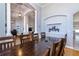 Open-concept dining room showcasing an elegant table and direct view into living room, great for entertaining at 3436 Herringridge Dr, Orlando, FL 32812