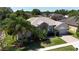Charming home featuring a stone accent facade, well-manicured lawn, and a brick driveway at 3436 Herringridge Dr, Orlando, FL 32812
