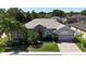 Beautiful one-story home with manicured lawn, brick-paved driveway, and attached two-car garage at 3436 Herringridge Dr, Orlando, FL 32812