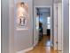 Hallway with hardwood floors, inset lighting, and doorway leading to a room at 3436 Herringridge Dr, Orlando, FL 32812