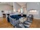 Spacious living room featuring an open layout, hardwood floors, and stylish decor with modern furnishings at 3436 Herringridge Dr, Orlando, FL 32812