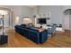 Open living room with hardwood floors, recessed lighting, and stylish furnishings with direct view to dining and kitchen at 3436 Herringridge Dr, Orlando, FL 32812