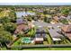Aerial view of home with a pool, solar panels, and a serene lake nearby at 368 Amethyst Ct, Lake Mary, FL 32746