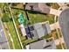 Aerial view of a well-maintained home with a pool, solar panels, and a wooden deck at 368 Amethyst Ct, Lake Mary, FL 32746