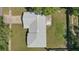 Birds eye view of the home showing the roof, driveway, and backyard at 5163 Lighthouse Rd, Orlando, FL 32808