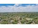 An aerial view of the neighborhood, highlighting the home's location near a pond at 5163 Lighthouse Rd, Orlando, FL 32808