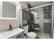 Modern bathroom showcasing tiled shower, updated vanity, and stylish fixtures at 5163 Lighthouse Rd, Orlando, FL 32808