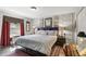 Well-lit bedroom featuring decorative wall paneling, accent lighting, and wood-look flooring at 5163 Lighthouse Rd, Orlando, FL 32808