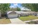 Charming single-Gathering home with attached garage, well-manicured lawn and inviting curb appeal at 5163 Lighthouse Rd, Orlando, FL 32808