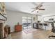 Inviting living room leading to kitchen with breakfast bar and patio area at 5163 Lighthouse Rd, Orlando, FL 32808