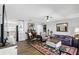 Open living space combining the kitchen and living room with hardwood floors at 5163 Lighthouse Rd, Orlando, FL 32808