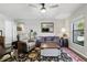 Comfortable living room features hardwood floors, ceiling fan and lots of furniture at 5163 Lighthouse Rd, Orlando, FL 32808