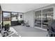 Enclosed patio with seating, potted plants, and access to the home and backyard at 5163 Lighthouse Rd, Orlando, FL 32808