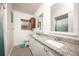 Bathroom with a double sink vanity, offering ample space and granite counters at 605 Oranole Rd, Maitland, FL 32751