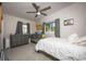 Well-lit bedroom featuring a comfortable bed and a ceiling fan, perfect for restful nights at 605 Oranole Rd, Maitland, FL 32751