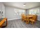 Inviting dining room with hardwood floors, bright light, and a wooden table with seating for six at 605 Oranole Rd, Maitland, FL 32751
