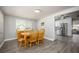 Inviting dining room with wood flooring and natural light, adjacent to the kitchen at 605 Oranole Rd, Maitland, FL 32751
