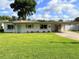 Charming single story home with a carport, well maintained lawn and mature trees at 605 Oranole Rd, Maitland, FL 32751