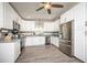 Modern kitchen with stainless steel appliances, granite countertops, and white cabinetry at 605 Oranole Rd, Maitland, FL 32751