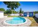 Sparkling pool with a sun deck, surrounded by lush landscaping and fencing at 605 Oranole Rd, Maitland, FL 32751
