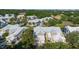 Aerial view showcases well-maintained residences surrounded by lush landscaping and mature trees within a residential community at 7021 Della Dr # 52, Orlando, FL 32819
