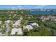 Stunning aerial view of the property showcasing its prime location near a tranquil lake and lush surroundings at 7021 Della Dr # 52, Orlando, FL 32819